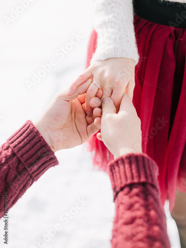 She said Yes! happy couple in winter photo