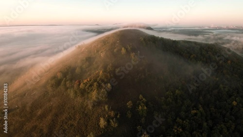 The remain of the reef of the ancient sea, composed of limestone - shikhan Yuraktau. Indian summer in the floodplain of the Belaya River. Aerial view. photo