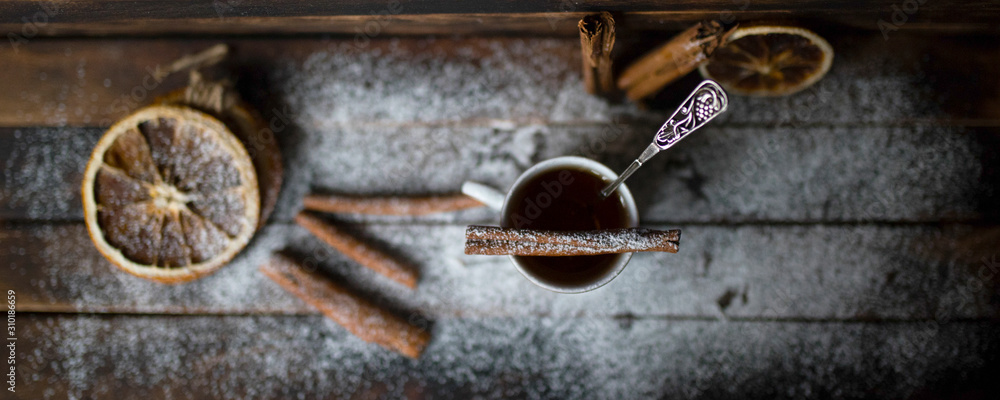 dried oranges cinnamon sticks on a wooden table dried oranges cinnamon sticks on a wooden table