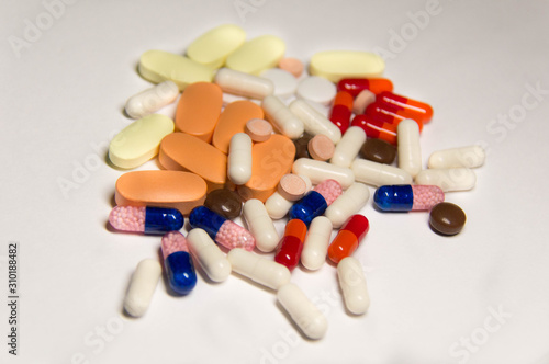 A lot of pills. A medicine for a sick person.