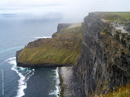 Tourists on cliff, Cliffs of Moher, Lahinch, County Clare, Ireland