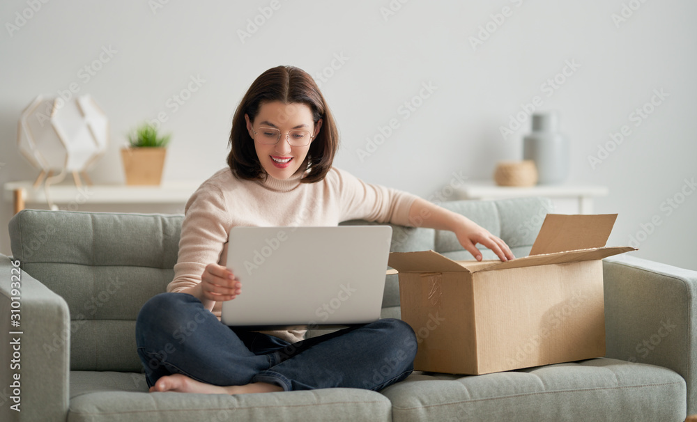 woman is holding cardboard box woman is holding cardboard box