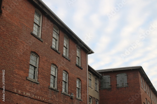 Old abandoned brick factory clock tower industrial vacant building with clock 