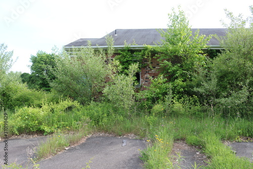 Vacant empty abandoned overgrown shopping plaza