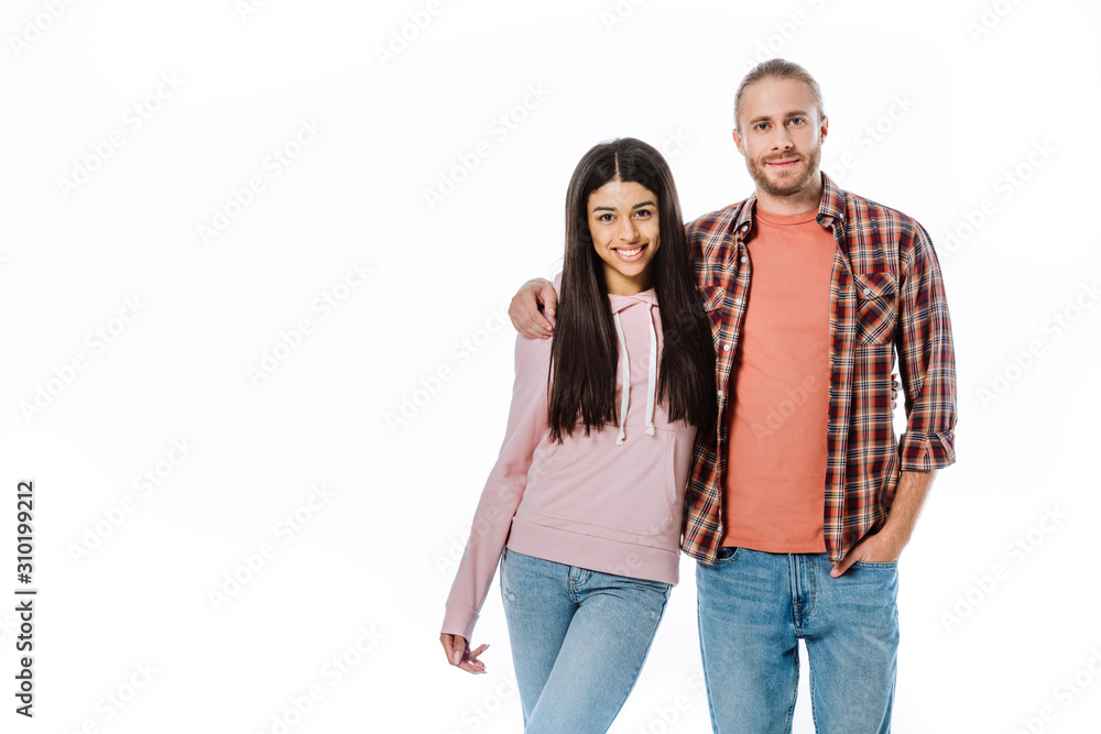 happy young interracial couple hugging isolated on white happy young interracial couple hugging isolated on white
