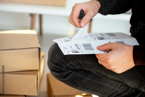 Delivery service, applying a shipping label photo