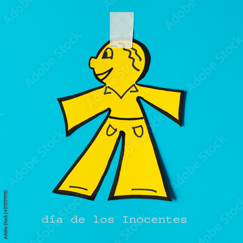 paper doll and text dia de los inocentes