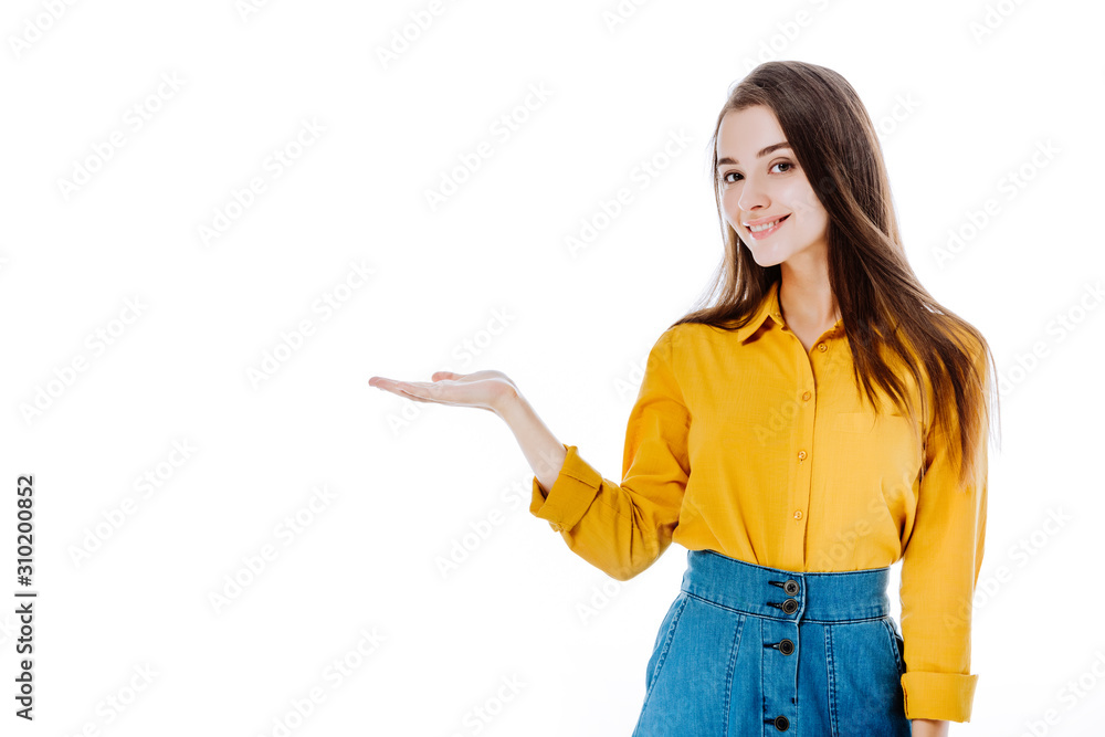 smiling attractive girl pointing with hand isolated on white smiling attractive girl pointing with hand isolated on white