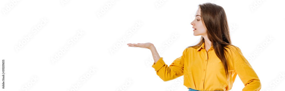 attractive girl pointing with hand aside isolated on white, panoramic shot attractive girl pointing with hand aside isolated on white, panoramic shot