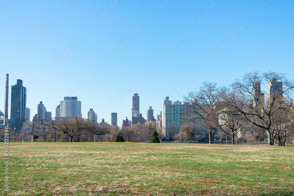 Open Grass Field at Rainey Park in Astoria Queens New York during Autumn with the Manhattan and Roosevelt Island Skyline Open Grass Field at Rainey Park in Astoria Queens New York during Autumn with the Manhattan and Roosevelt Island Skyline