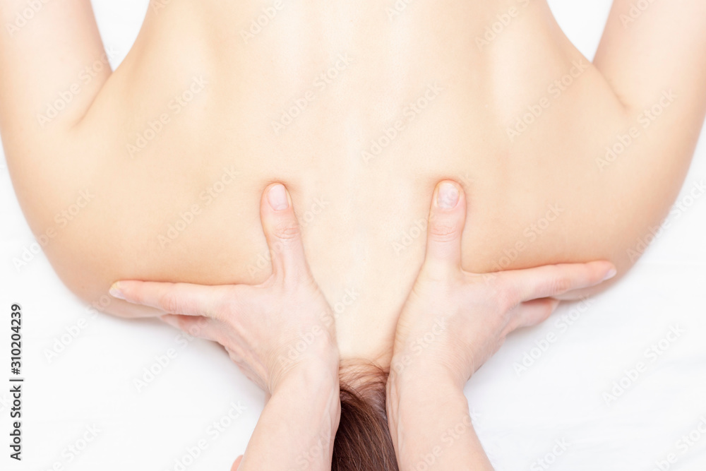 Massage and body care. Spa body massage woman hands treatment. Woman having massage in the spa salon for girl Massage and body care. Spa body massage woman hands treatment. Woman having massage in the spa salon for girl