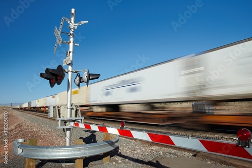 Foto Train passing level crossing motion blur