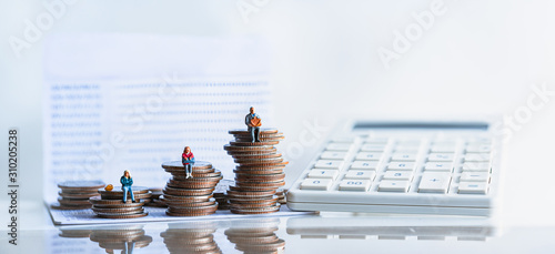 Miniature people: Elderly people sitting on coins stack. pensions and retirement planning. money saving and Investment. Time counting down for retirement concept.