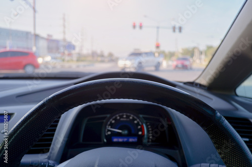  the driver holding steering wheel in the car.