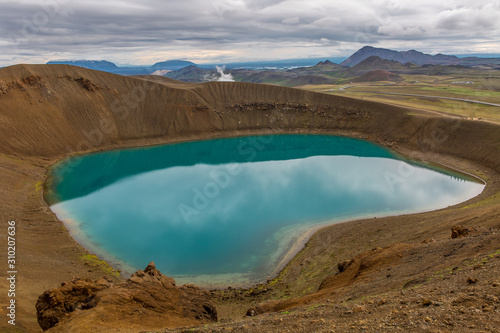 Panoramic view of the crater of the volcano with turquoise water inside