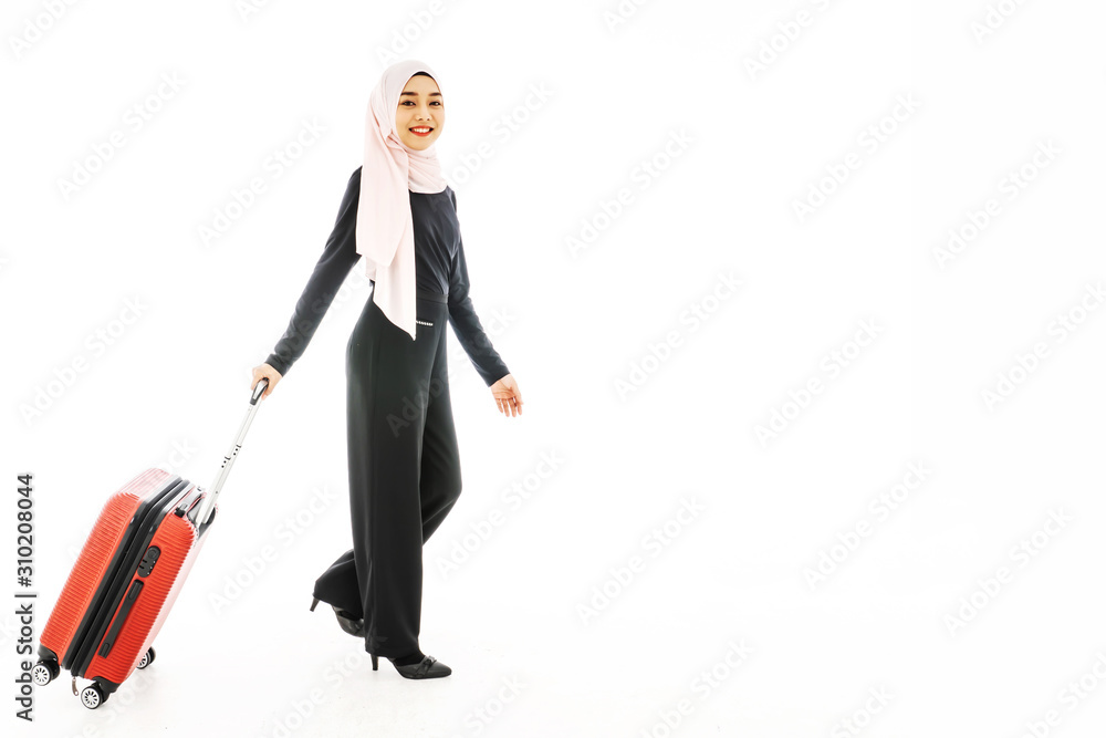 Portrait of beautiful asian muslim tourist traveller woman in a hijab holding red suitcase luggage get ready for traveling and trip and smiling isolate on white background. Portrait of beautiful asian muslim tourist traveller woman in a hijab holding red suitcase luggage get ready for traveling and trip and smiling isolate on white background.