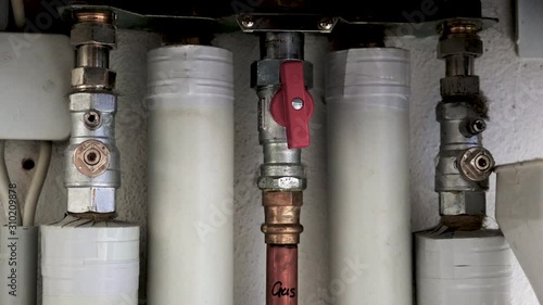  Heating installation under a water boiler with copper piping