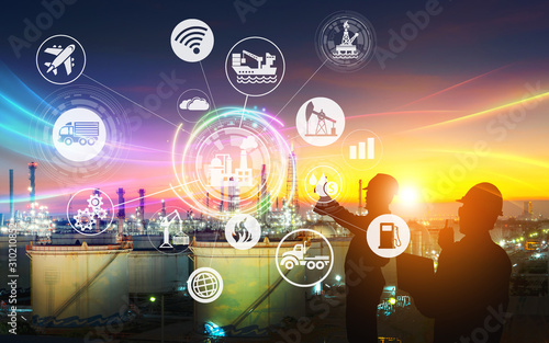 Silhouette of the engineering team is working at the oil refinery and icons connecting networking using industry concept