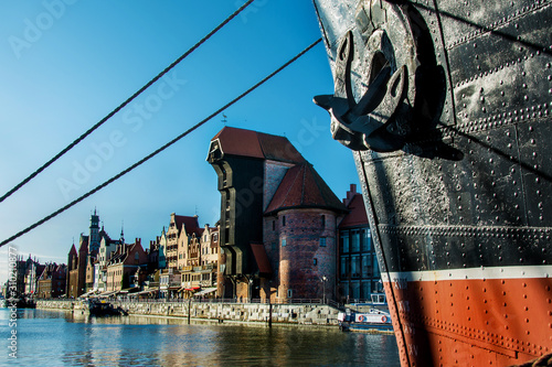 View of old town Gdansk (Gdańsk), Poland (Polska) with, merchants' houses, Motlawa (Motława) river and famous historic Medieval Crane (Żuraw). Ship 