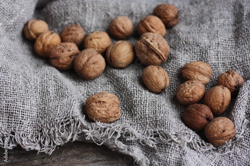 Walnuts on a grey linen background macro 