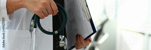 Female doctor hand hold phonendoscope in medical
