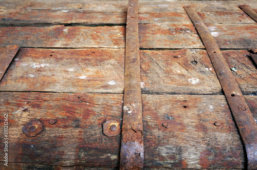 Metal rusty surface of old wooden kist. photo