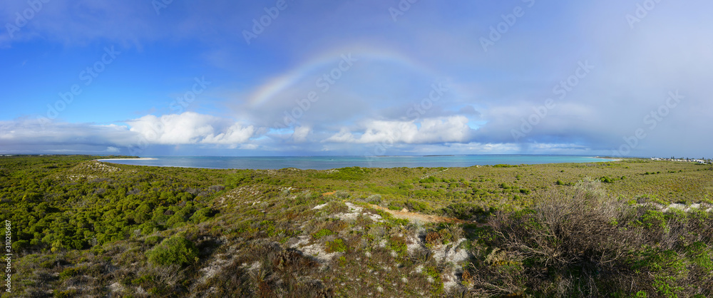 Rainbow over the Lake Thetis area in Nambung National Park, a saline coastal lake with stromatolites in Cervantes, Western Australia