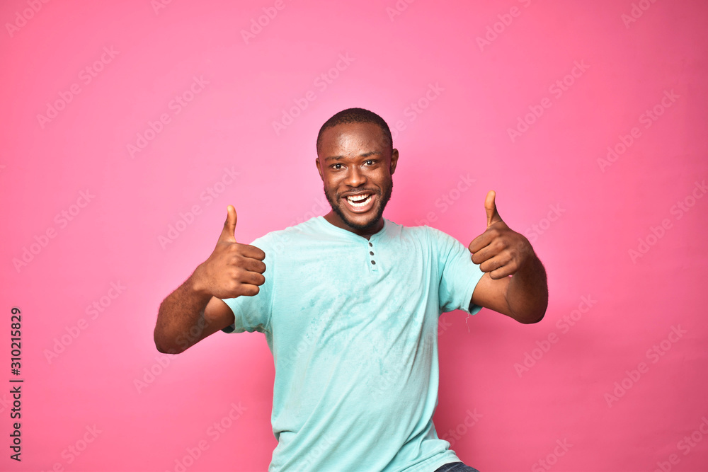 handsome excited young black man feeling excited giving thumbs up gesture handsome excited young black man feeling excited giving thumbs up gesture