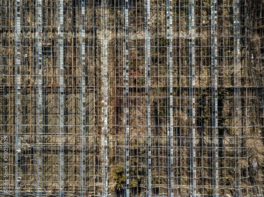 Metal framework of greenhouses on a ground of drone view. Metal framework of greenhouses on a ground of drone view.