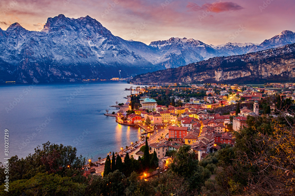 Beautiful Panorama in the Torbole a small town on Lake Garda in the winter time  at sunset, Lake Garda surrounded by mountains, Trentino Alto Adige region, Lago di garda, italy - obrazy, fototapety, plakaty 