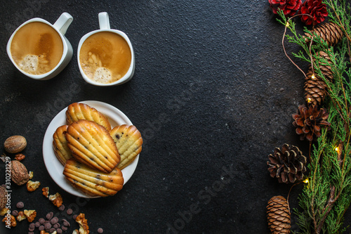 Madeleine cookies, sweet dessert and coffee on the table (delicious pastries, sweets) menu concept. food background. top view. copy space
