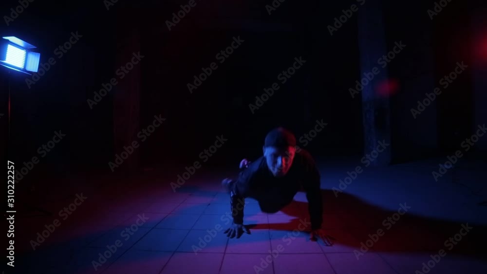 Young guy dancing breakdance, hip hop, street dancing in the studio, isolated Young guy dancing breakdance, hip hop, street dancing in the studio, isolated