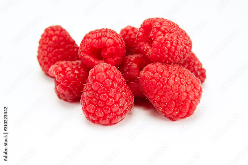 bunch of raspberries on a white background bunch of raspberries on a white background