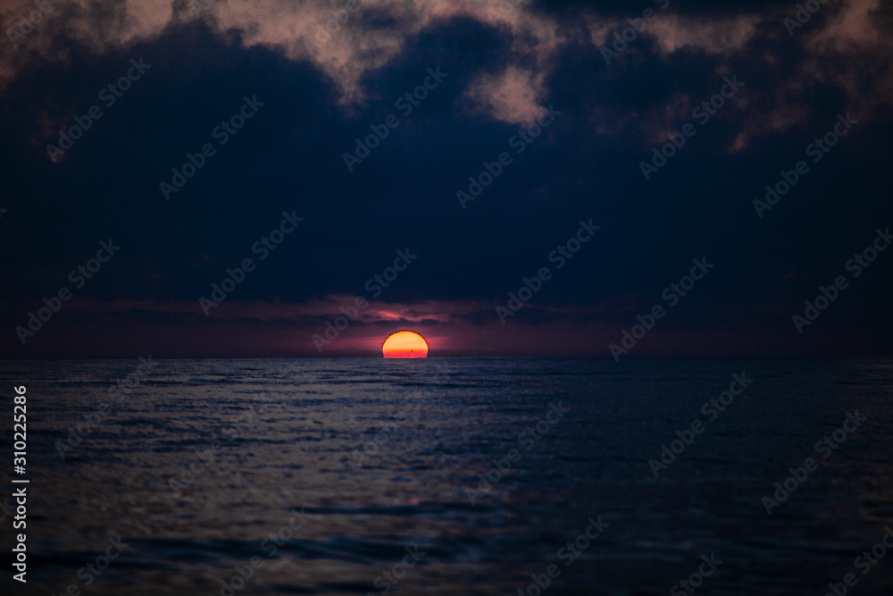 sun at sunset on the sea