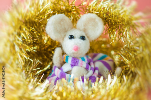 handmade white mouse symbol of the new year surrounded by tinsel and sparkle © 3dmart