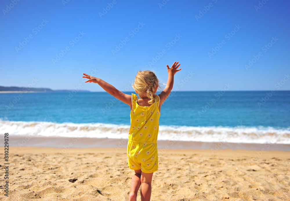 LIttle active girl playing on the sand beach LIttle active girl playing on the sand beach