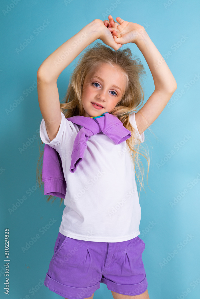 Sports teenager girl in sport suit do exercises isolated on background Sports teenager girl in sport suit do exercises isolated on background