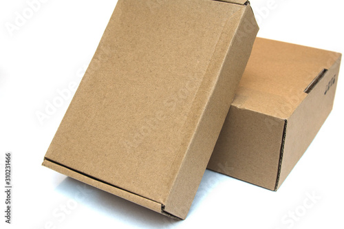 Cardboard boxes isolated on white background. Delivery or moving concept. Gift box. Recycling materials concept. Selective focus. © Дмитрий Березнев