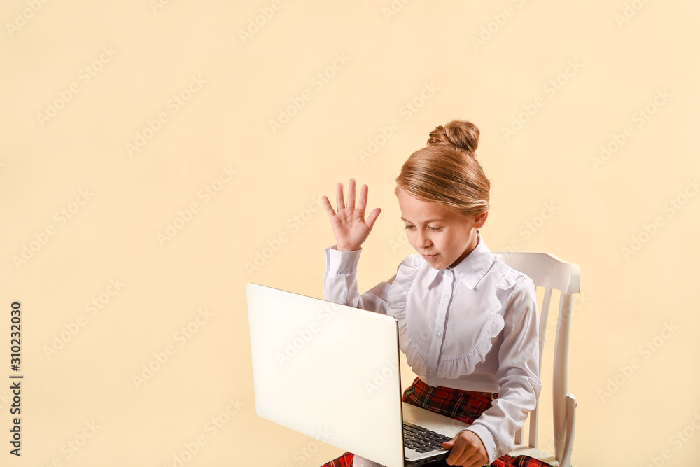 little business girl write in notepad. Business style clothing, plaid skirt, white blouse. Work at the laptop. Emotional child, laughs and screams. Surprise and bewilderment little business girl write in notepad. Business style clothing, plaid skirt, white blouse. Work at the laptop. Emotional child, laughs and screams. Surprise and bewilderment