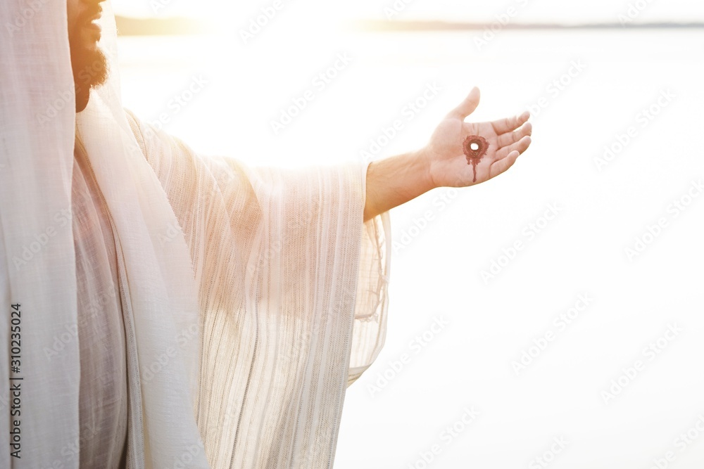 Resurrected Jesus Christ with the scars of the nails on his hands foto