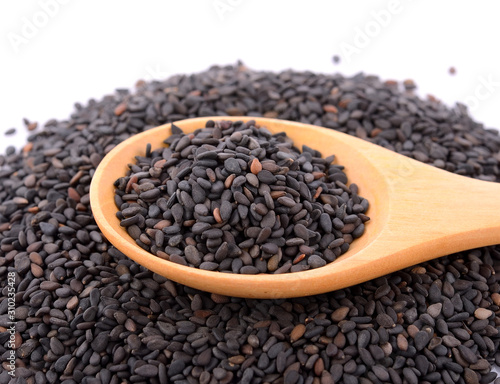 Black Sesame Seeds in wooden spoon