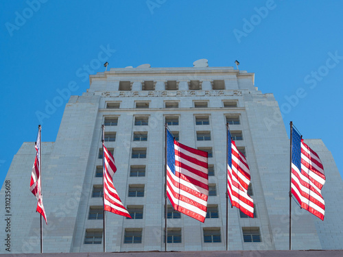 Close up of flags waving in the City Hall, blue sky with clouds. California. United States