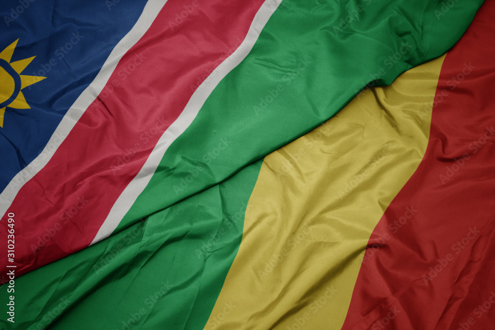 waving colorful flag of republic of the congo and national flag of namibia.