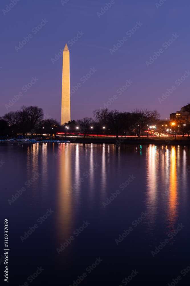 Washington Monument and Early Morning Traffic Reflecting in the Tidal Basin