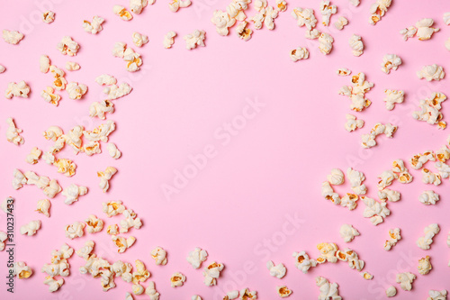 popcorn on a colored background top view with place for text