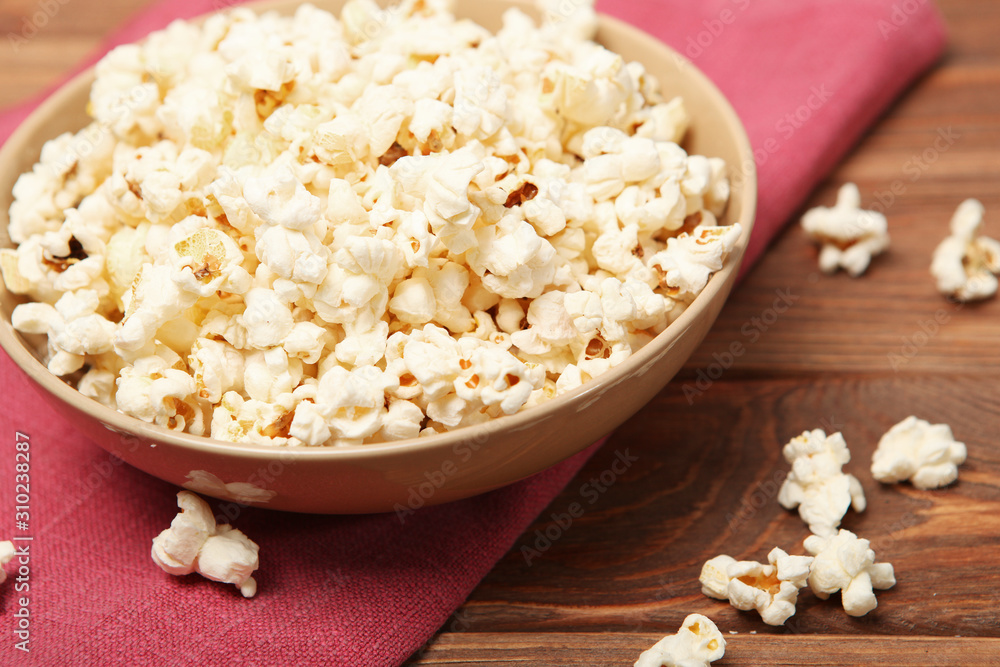 popcorn in a plate on the table popcorn in a plate on the table