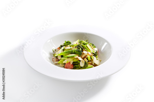 Salad with Avocado, Broccoli, Cucumber and Almonds Isolated
