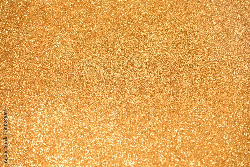 Gold Glitter background. New Year, Holiday, Christmas, Valentines, Beauty and Nails abstract sparkling texture Gold Glitter background. New Year, Holiday, Christmas, Valentines, Beauty and Nails abstract sparkling texture