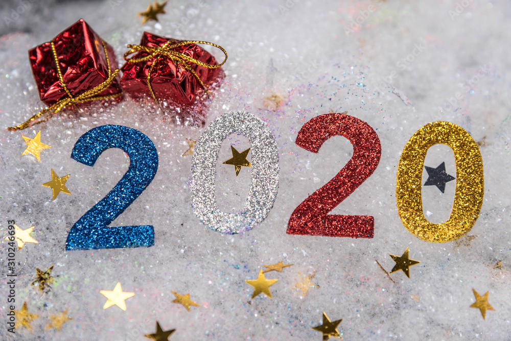 Abstract winter New Year`s and Christmas background from foam. text on foam 2020
