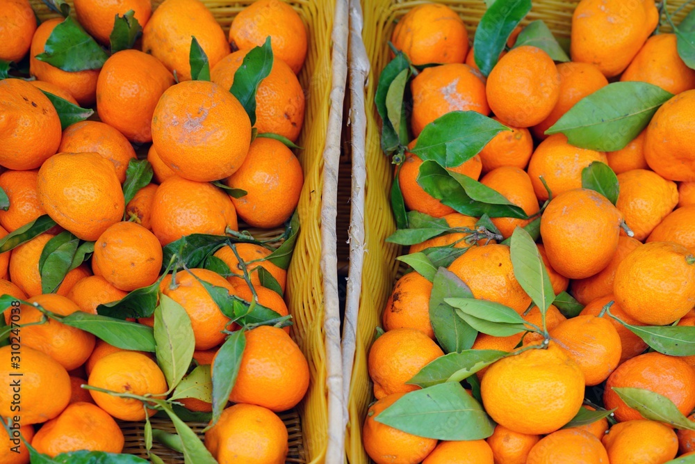 Fresh orange clementines for sale at a farmers market in Australia